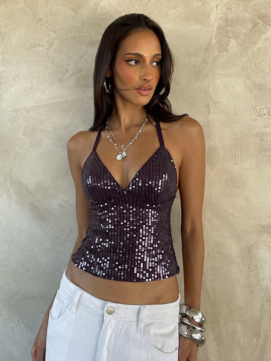 Women's black faux leather backless cami top with spaghetti straps and lace-up shirred sides.