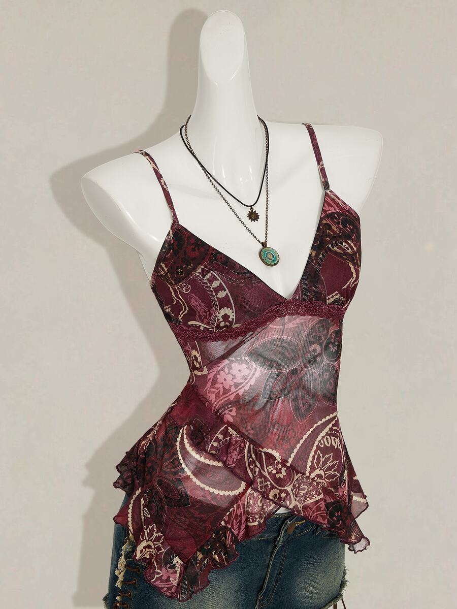 Women's burgundy floral graphic print mesh camisole top featuring an asymmetrical hem, backless cut, and spaghetti straps.