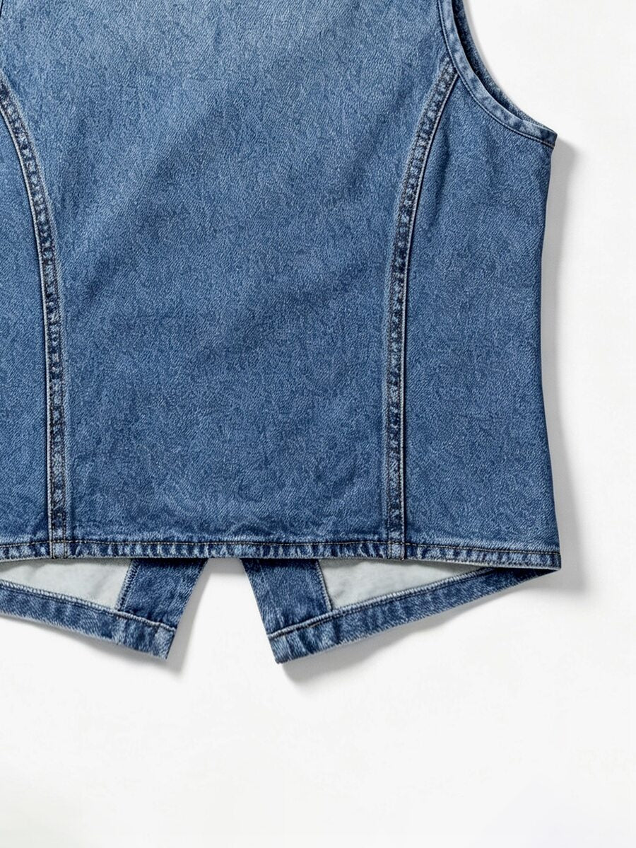 Woman wearing a blue denim print tank top featuring a button-front design, asymmetrical hem, and matching detached arm sleeves.