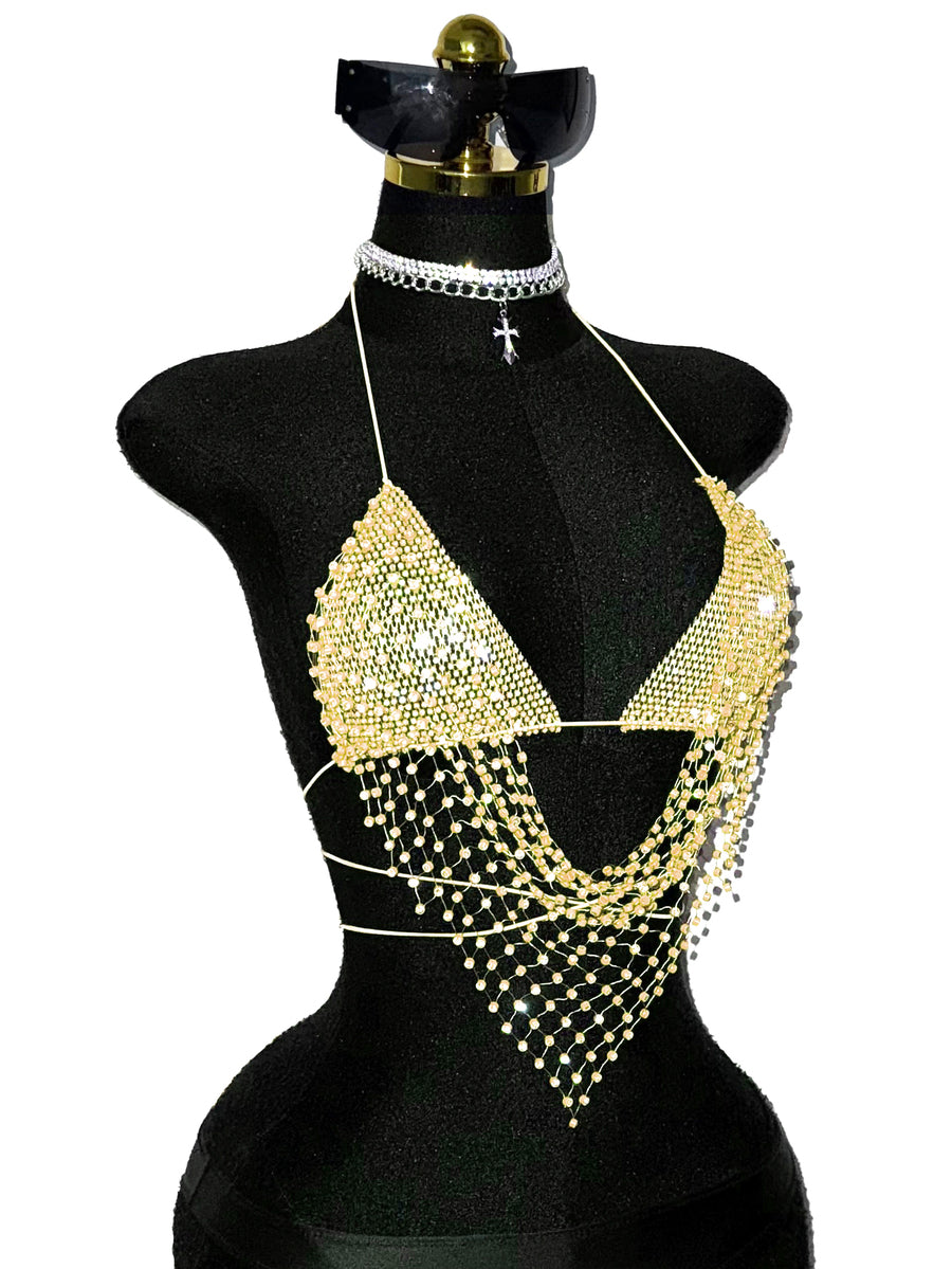 Black sheer mesh halter top for women featuring rhinestone glitter effect, backless design, chain details, and an asymmetrical hem.