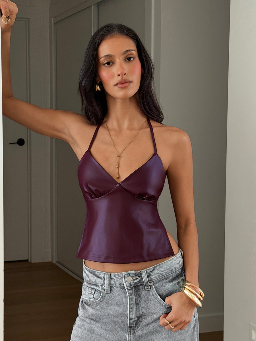 Women's black faux leather backless cami top with spaghetti straps and lace-up shirred sides.
