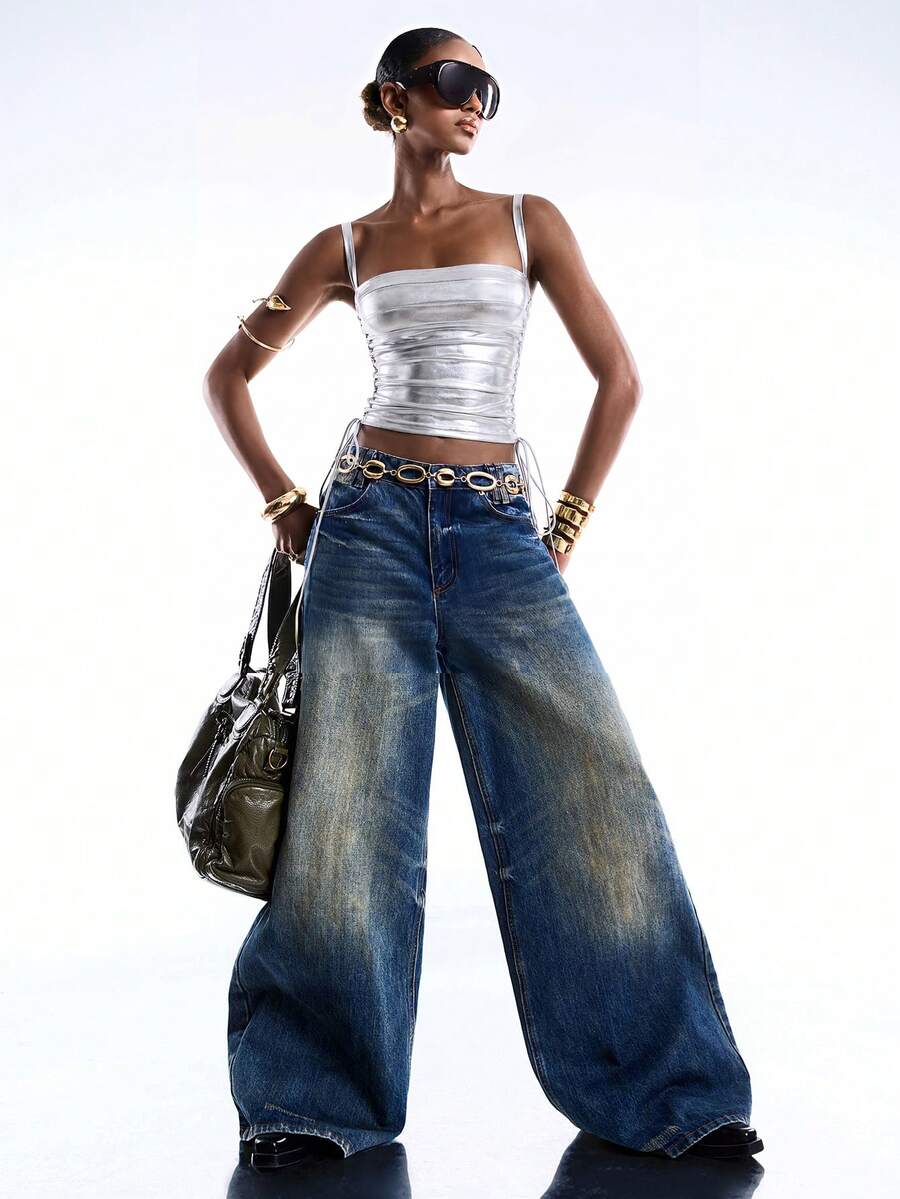 Black PU leather cropped camisole top for women featuring spaghetti straps, side tie details, and a ruched slim fit.