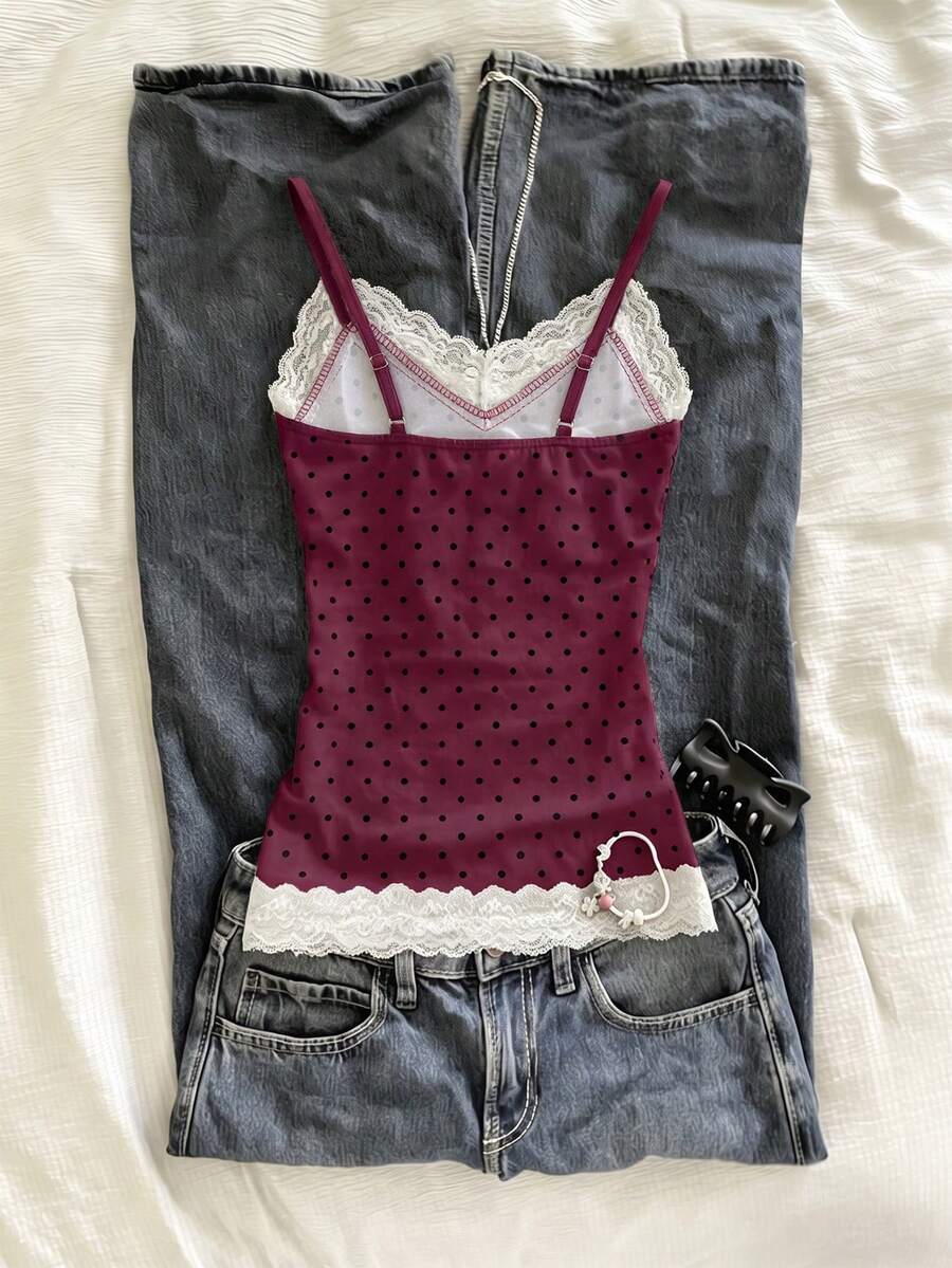 Women's solid color slim fit camisole top featuring delicate lace patchwork embroidery and tank straps.