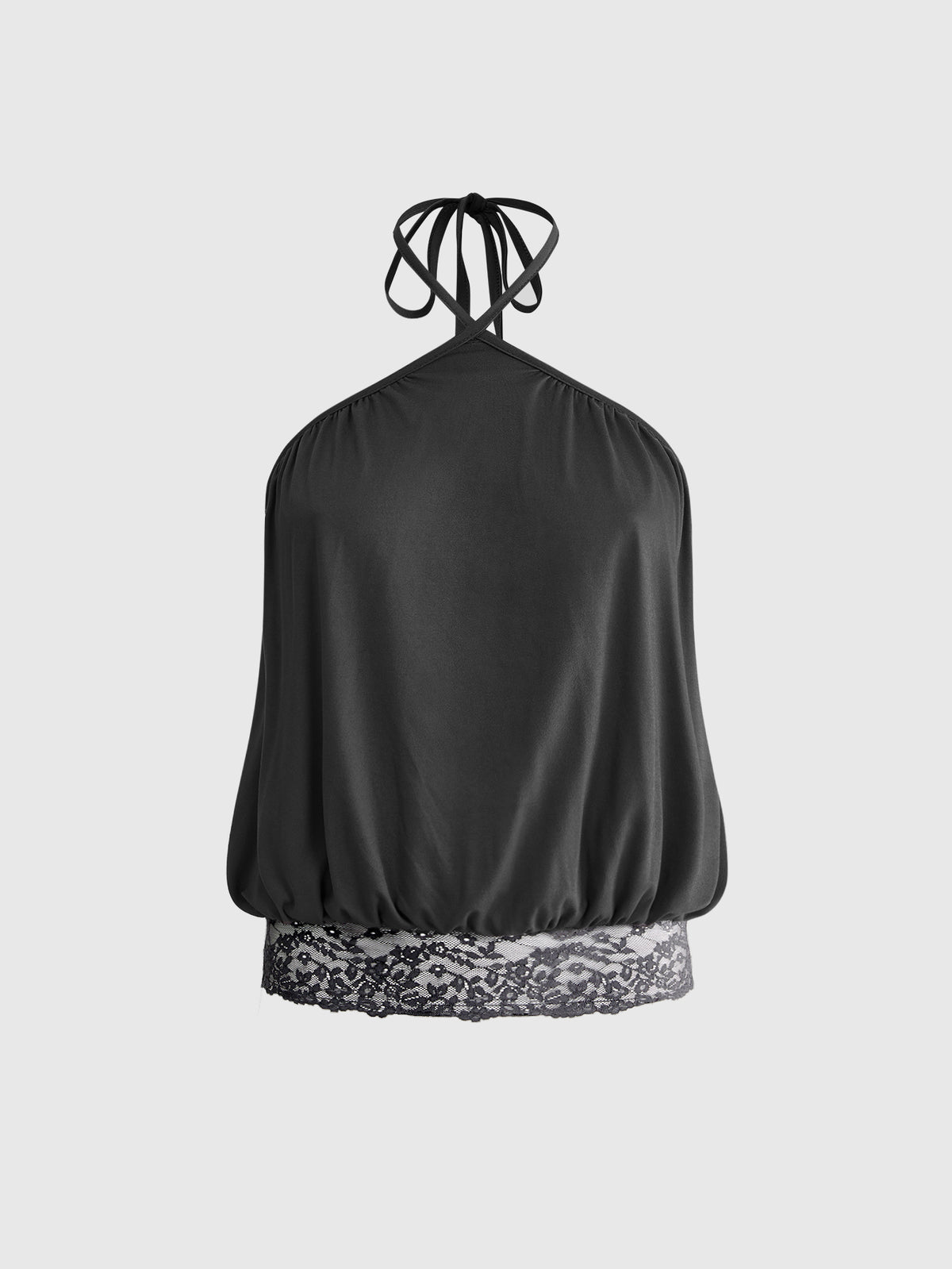Woman wearing a black slim fit halter camisole crop top with lace-up backless tie detail.