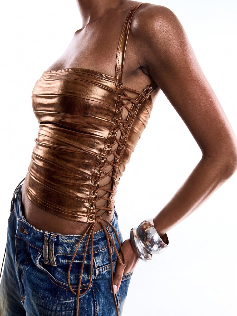 Black PU leather cropped camisole top for women featuring spaghetti straps, side tie details, and a ruched slim fit.