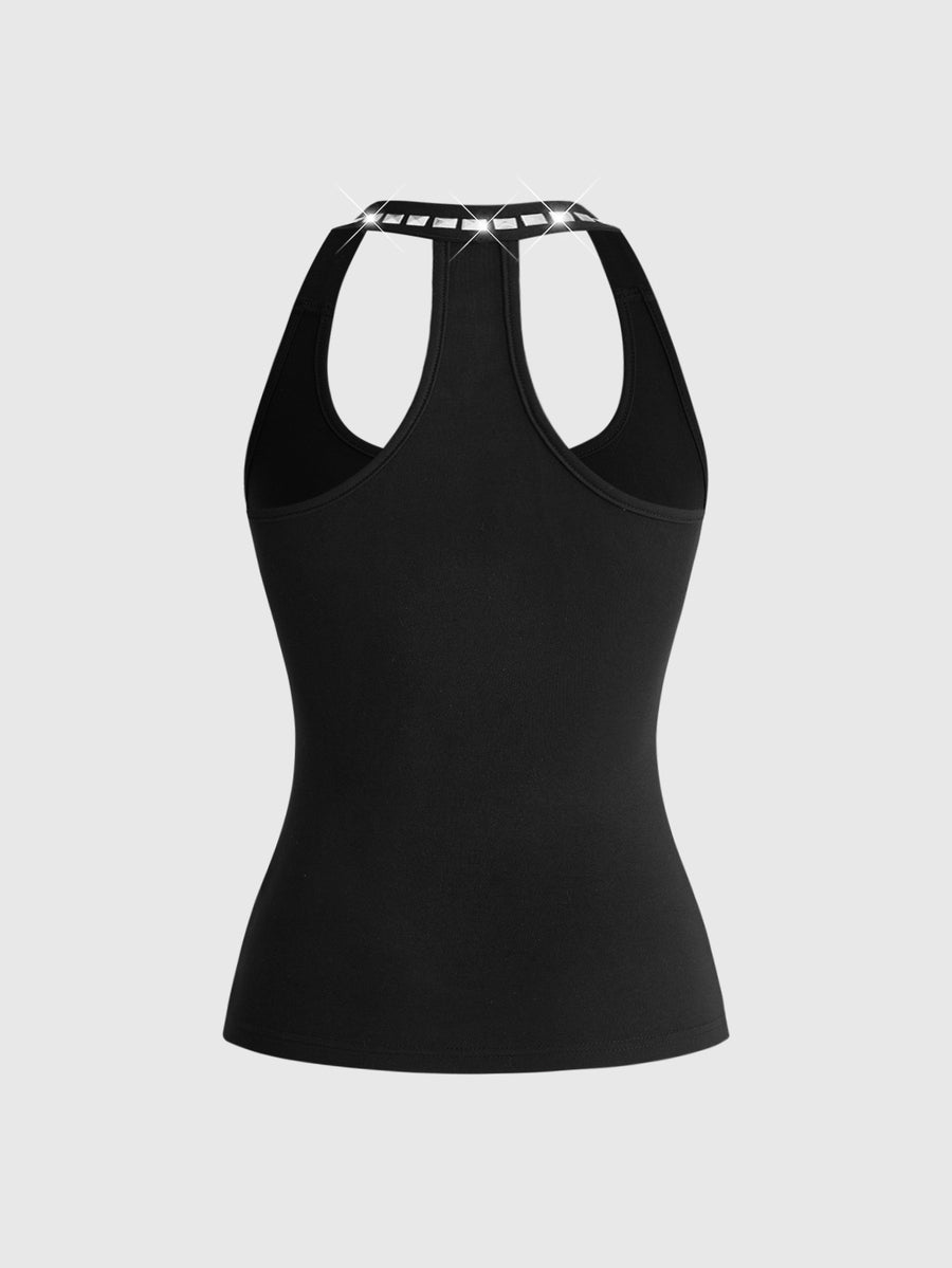 Black backless halter crop tank top with metal rivet trim detail and slim fit.