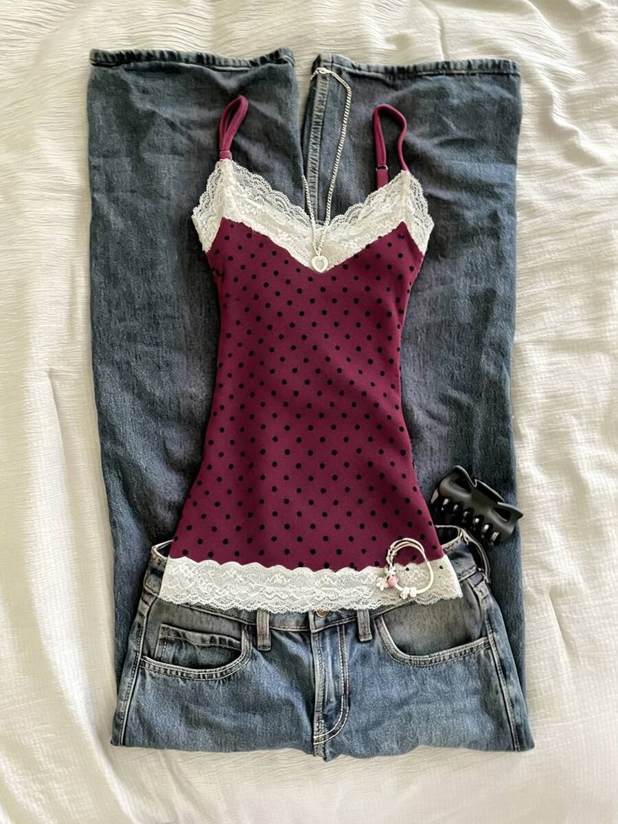 Women's solid color slim fit camisole top featuring delicate lace patchwork embroidery and tank straps.