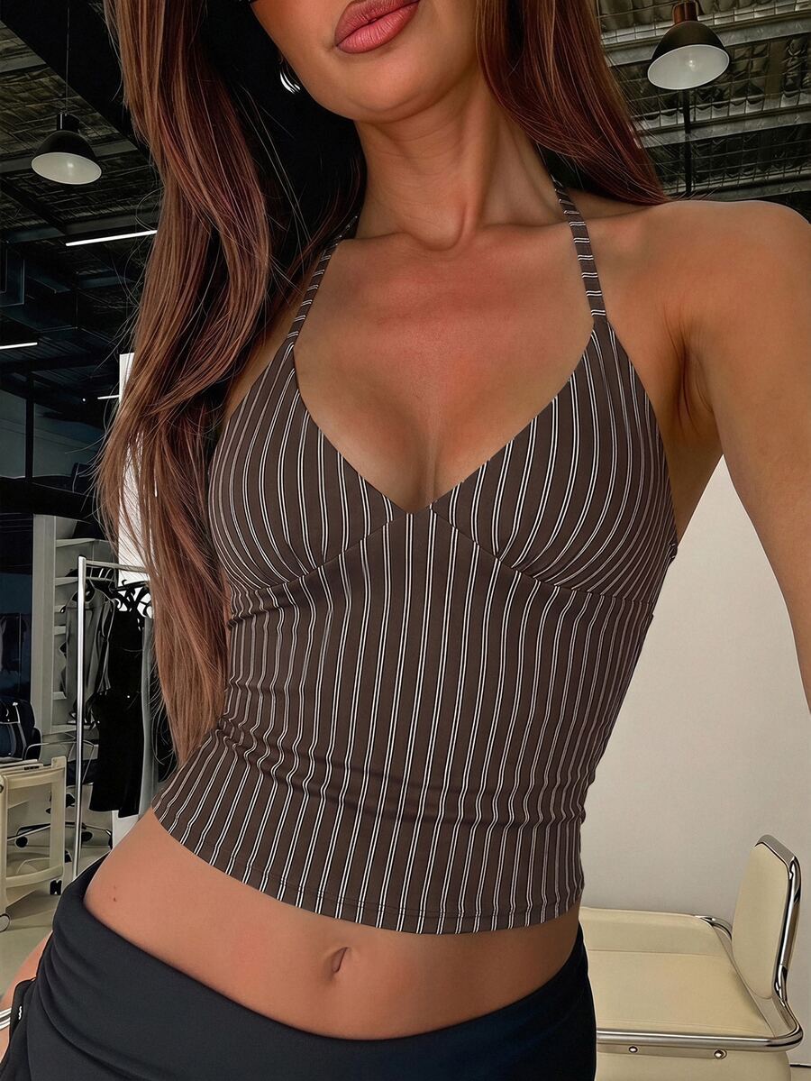 Women's black faux leather backless cami top with spaghetti straps and lace-up shirred sides.