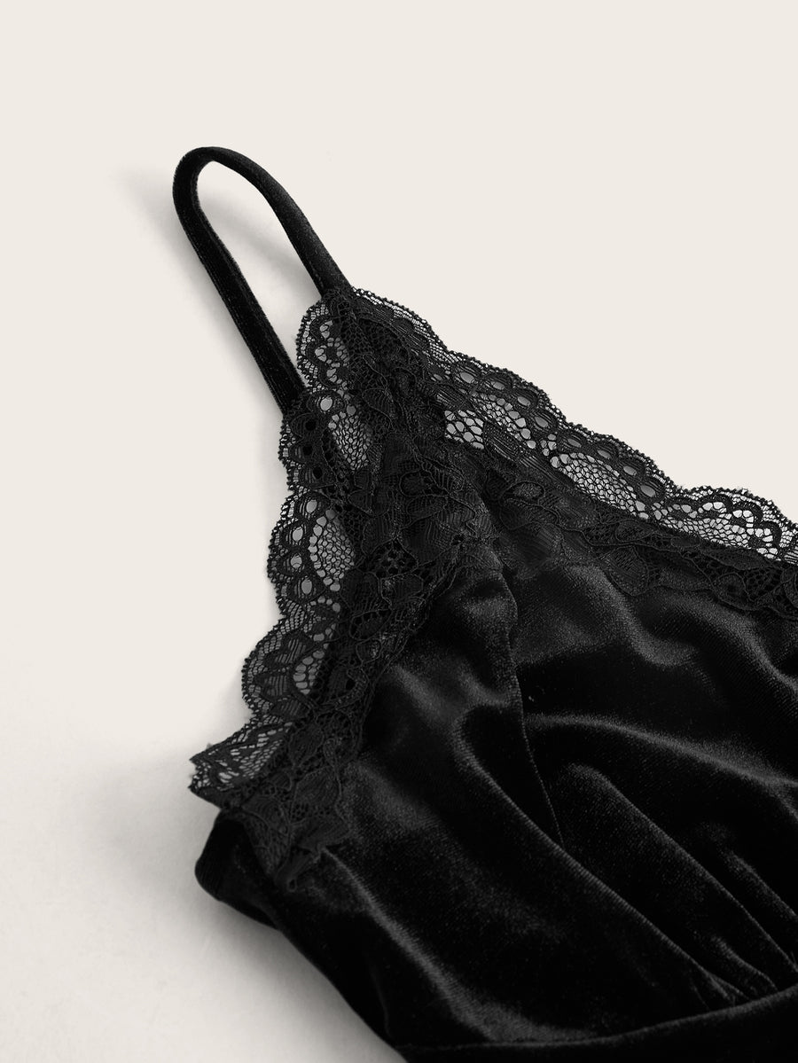 Black gothic velvet crop tank top for women featuring contrast lace trim, bow accent, spaghetti straps, and a metal cross detail.