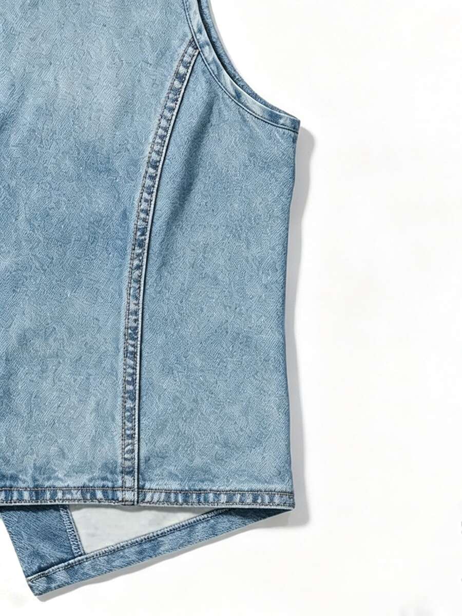 Woman wearing a blue denim print tank top featuring a button-front design, asymmetrical hem, and matching detached arm sleeves.