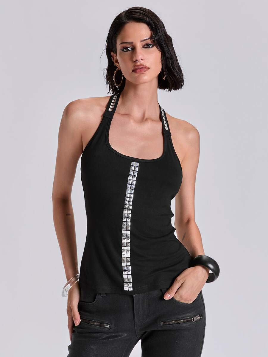 Black backless halter crop tank top with metal rivet trim detail and slim fit.
