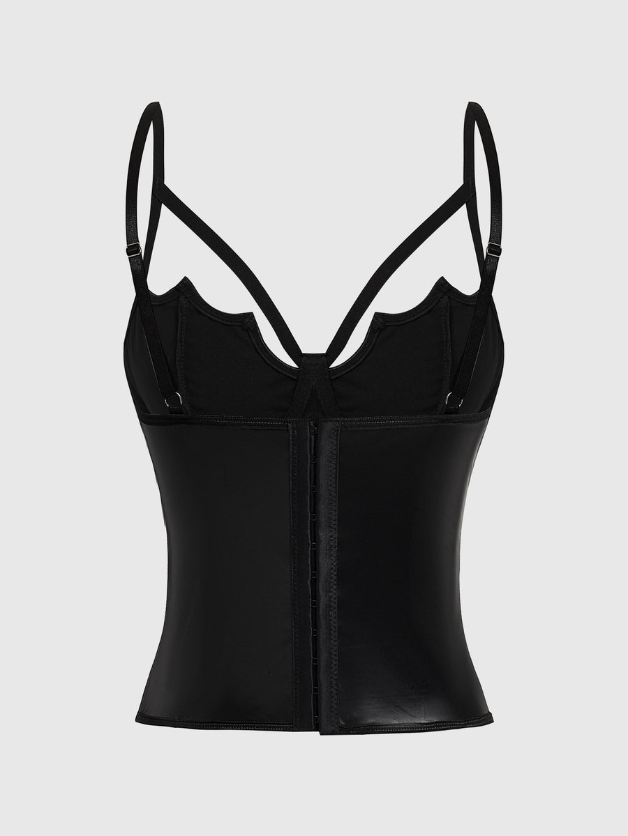 A women's black velvet crop camisole top featuring criss-cross shoulder straps, asymmetrical cut-out details, and a sleeveless vest neckline.