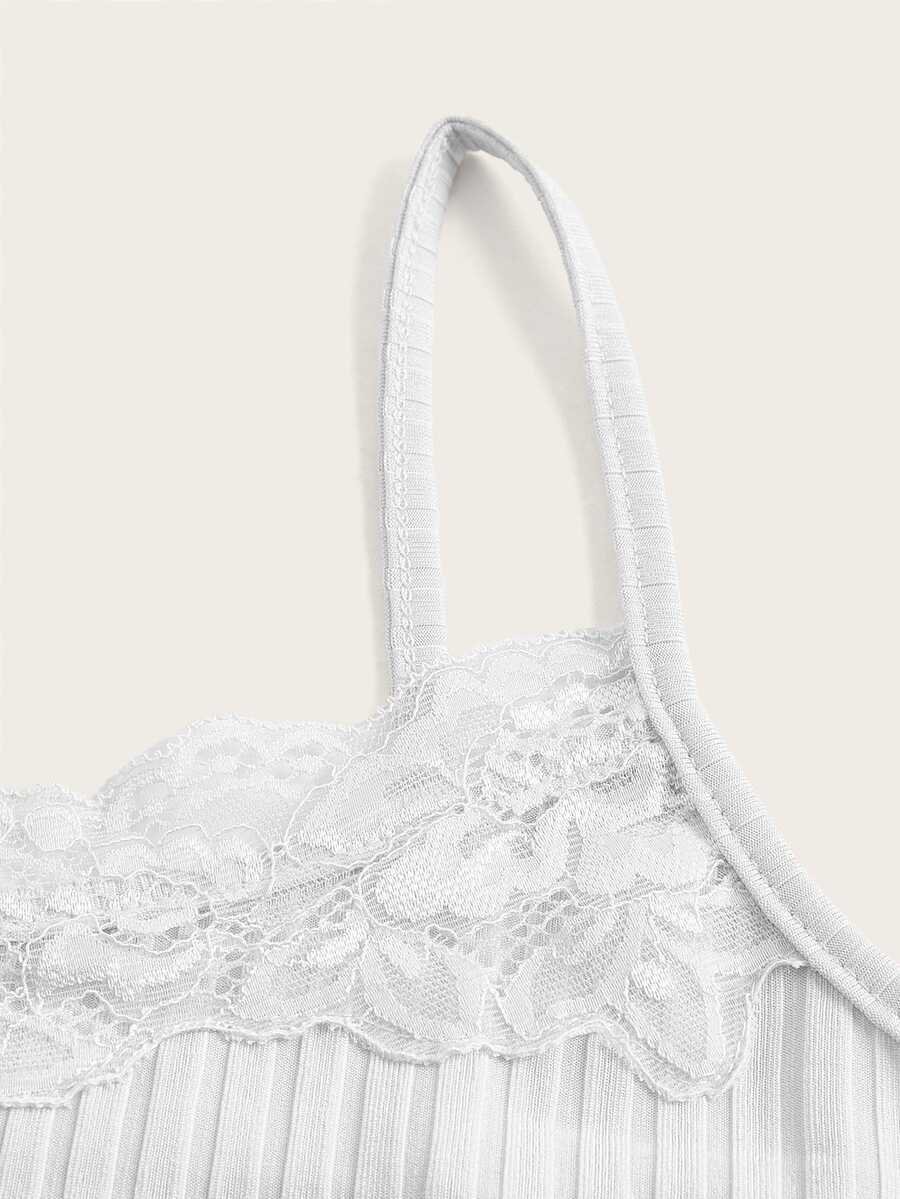 Women's black rib-knit cami top featuring delicate contrast lace trim and thin spaghetti straps.