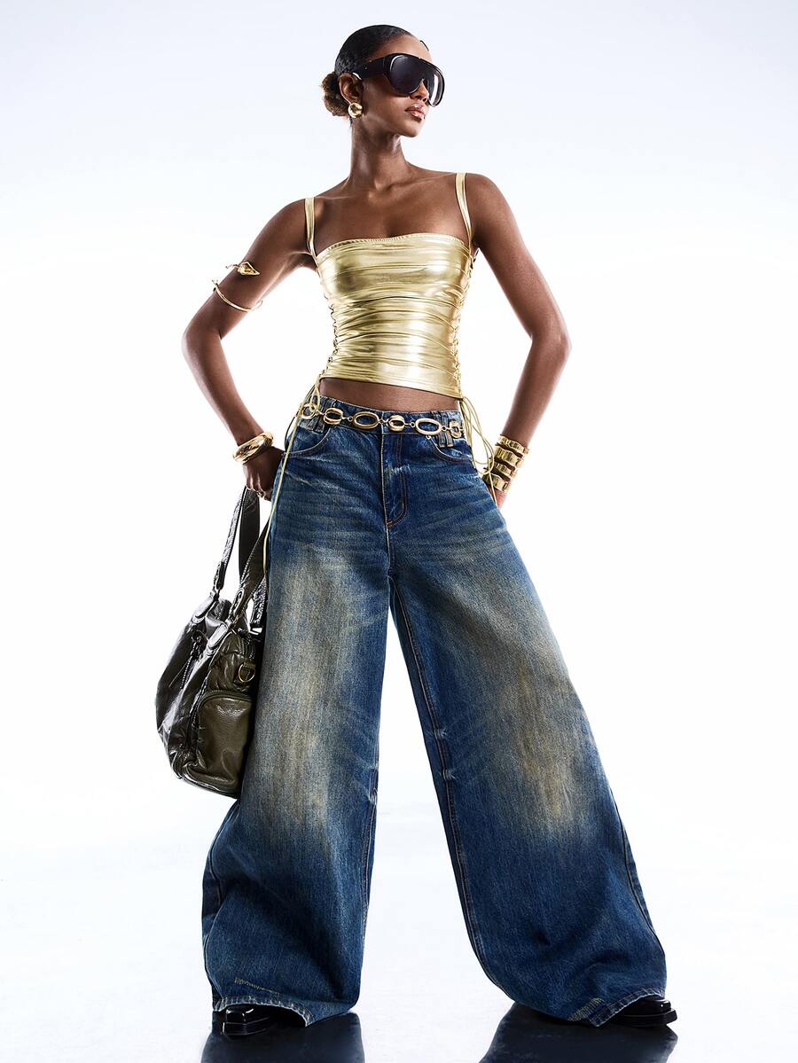 Black PU leather cropped camisole top for women featuring spaghetti straps, side tie details, and a ruched slim fit.