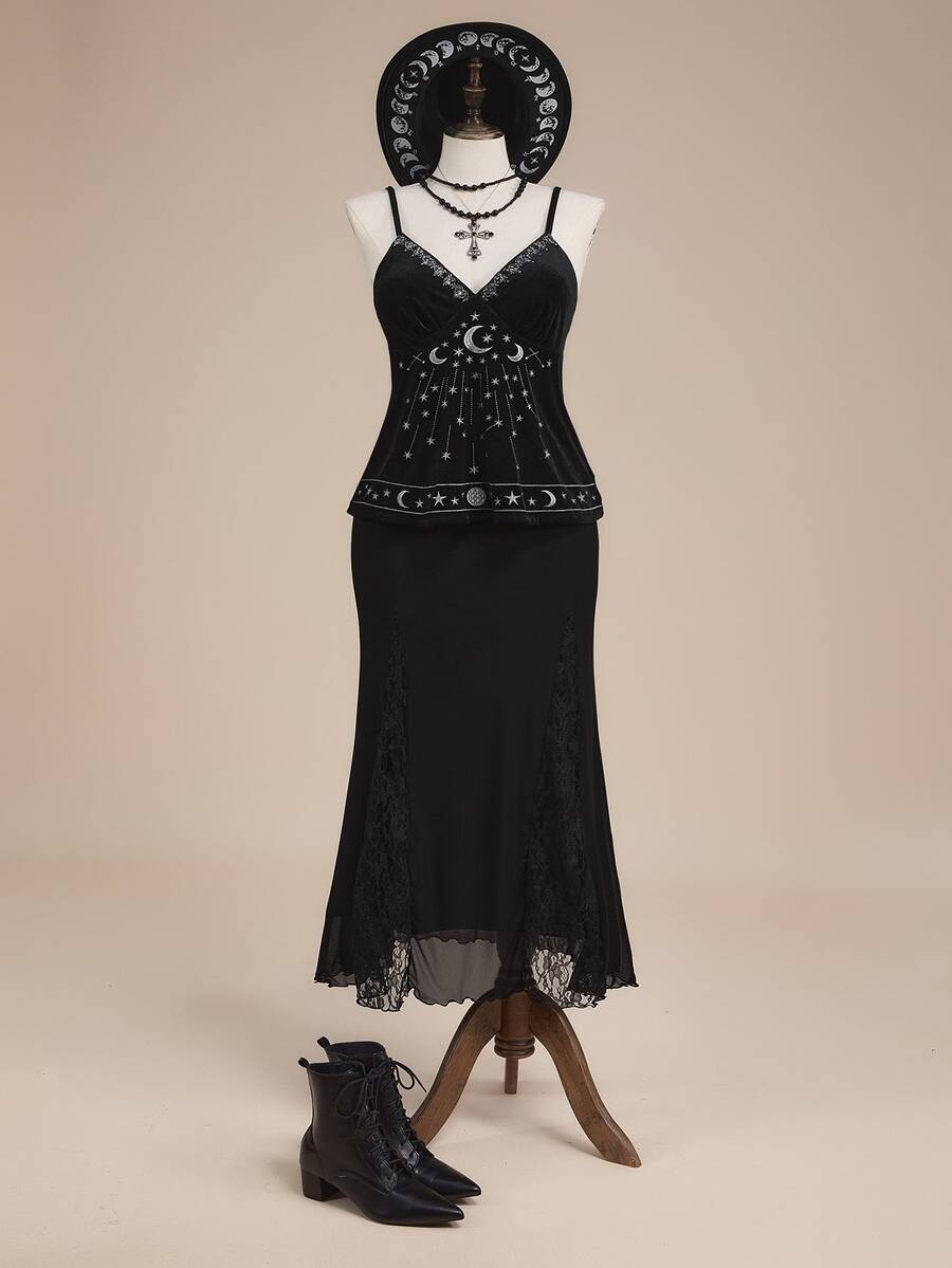 Black velvet camisole top featuring an astrology moon and star graphic print, spaghetti straps, and a backless lace-up design.
